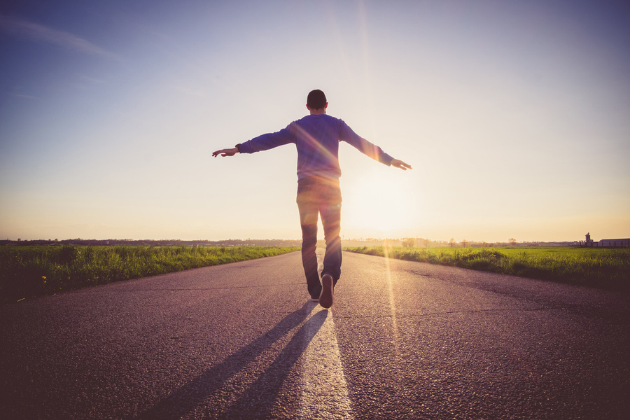 Man walking on a street line